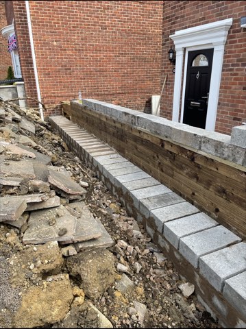 Driveway, sleeper walls and oak porch