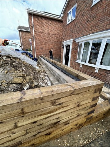Driveway, sleeper walls and oak porch