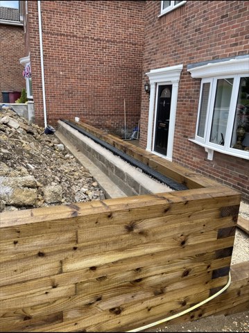 Driveway, sleeper walls and oak porch