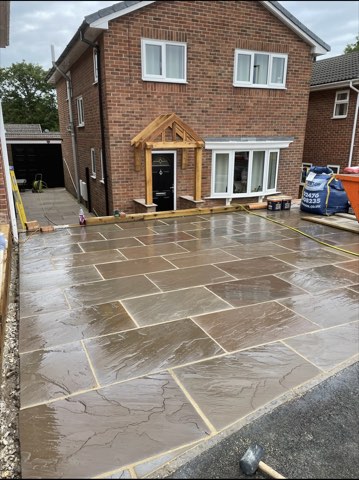Driveway, sleeper walls and oak porch